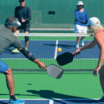 People Playing pickle ball on flat count in aspen colorado